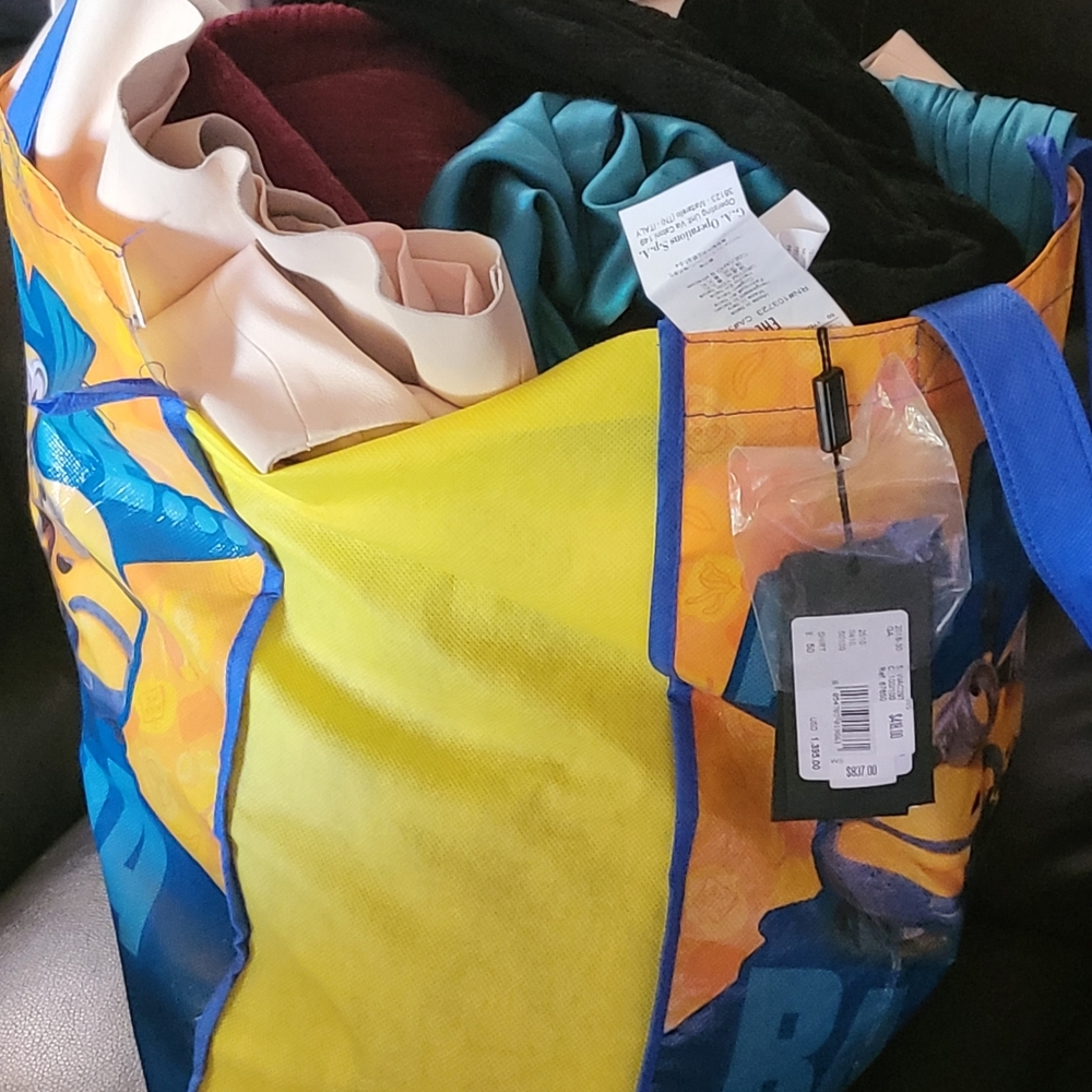 Bag of designer clothes, most with tags still attached. Selling as bundle.